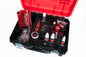 Open tool case with automotive tools and products on a white background